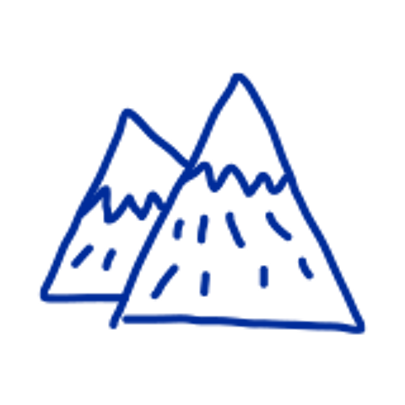 The image shows a simple, cartoon-style drawing of two mountains. The mountains are depicted with triangular shapes and jagged peaks, suggesting a rugged terrain. Dashed lines adorn the sides of the mountains, possibly representing snow or rocky textures. The drawing is done in a single color, giving it a minimalist and somewhat childlike appearance. The overall impression is one of a basic, almost iconic representation of mountains.